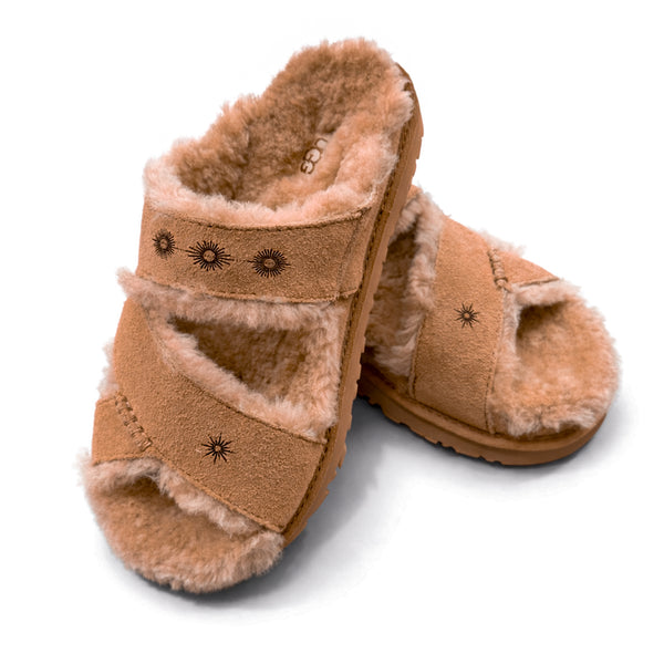 fur lined greenport Ugg cross strap slide, in chestnut, with Dominique Cohen sunburst detailing<span class='visuallyhidden'>Shop help at 323-404-2959.</span>