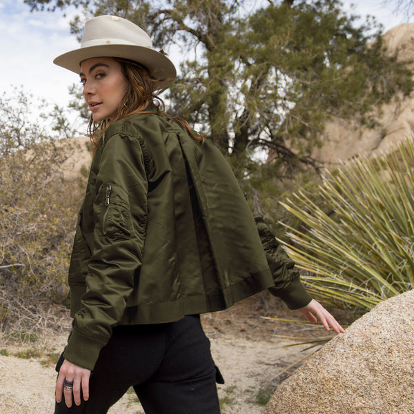 Dominique Cohen limited edition bomber jacket, in olive,<br>shown as an optional jacket for shop the look > walkabout <span class='visuallyhidden'>Text, call 323-404-2959 for shopping assistance.</span> <span class='visuallyhidden'>Text, call 323-404-2959 for shopping assistance.</span>