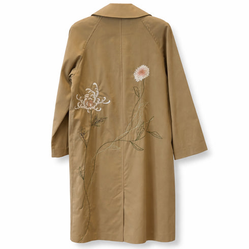 our one of a kind trench coat, in earth, with bespoke floral embroidery<span class='visuallyhidden'>; shop help at 760-978-9297.</span>