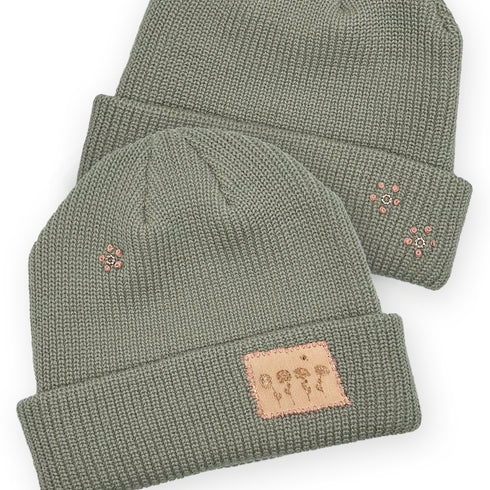 Dominique Cohen designer beanie in floral motif with 18k gold plated flower pistil accents <span class='visuallyhidden'>Text, phone 323-404-2959 for shop help.</span>