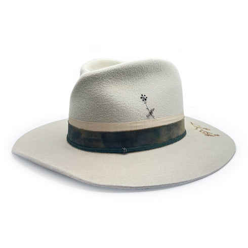 Dominique Cohen knockout neutral hand-tooled designer hat<br>detailed in antiqued silver, a champagne diamond, silk, suede, and sterling silver, angled view <span class='visuallyhidden'>Call, text 323-404-2959 for shopping assistance</span>