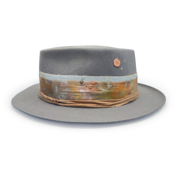 diamond-kissed, aquamarine, and rose gold textural rings adorn her left side<span class='visuallyhidden'>; shop help at 760-978-9297.</span>