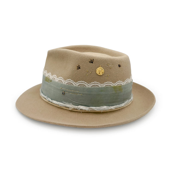 Luck Be A Lady, a Sinatra-inspired designer hat dressed in diamond and blue sapphire kissed jewelry <span class='visuallyhidden'>Call, text 323-404-2959 for shop help.</span>