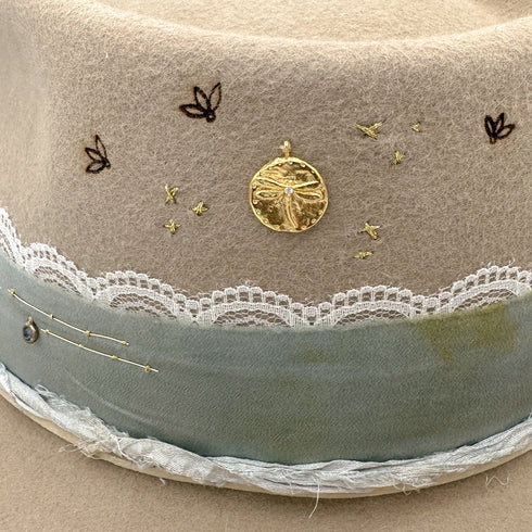 up close, the diamond-kissed dragonfly charm, dragonfly burns, and blue sapphire bezel charm <span class='visuallyhidden'>Call, text 323-404-2959 for shop help.</span>