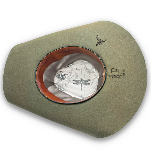 lined in silks and leather, and with a floral skull burned into her brim <span class='visuallyhidden'>Call, text 323-404-2959 for shop help.</span>