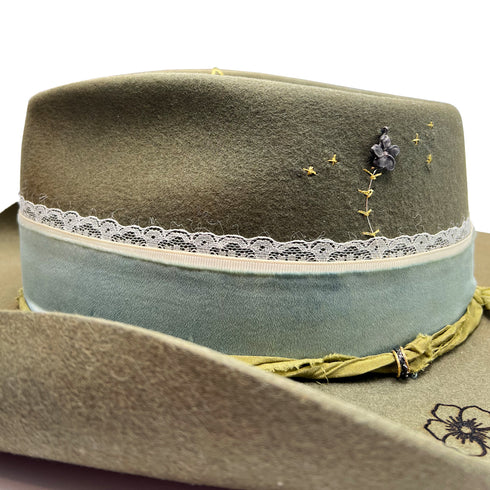 her jewelry includes raw diamonds + trio of textural rings (along her moss tie) <span class='visuallyhidden'>Call, text 323-404-2959 for shop help.</span>