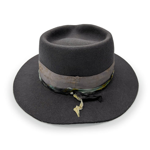 from behind, her double-wrapped, hand-dyed silk dressed to perfection + her flexible brim flipped up<span class='visuallyhidden'>; shop help at 760-978-9297.</span>