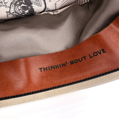 we stamped her name into her leather band; custom phrasing available<span class='visuallyhidden'>; shop help at 760-978-9297.</span>