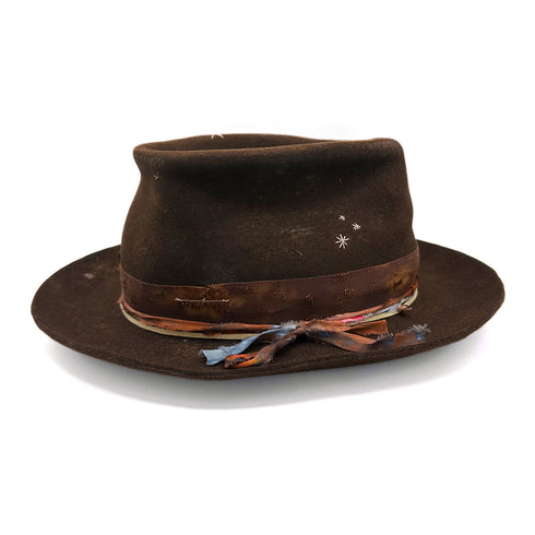 Share Your Magic, a Dominique Cohen hat in chocolate felt and with diamond-kissed rose gold accents<span class='visuallyhidden'>; shop help at 760-978-9297.</span>