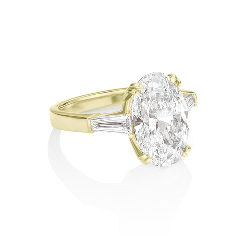 grande oval diamond ring with tapered baguette bookends, angle view<span class='visuallyhidden'>; shop help at 760-978-9297.</span>