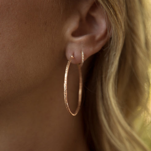 Dominique Cohen texture hoop gold earrings,<br>shown stacked with our diamond huggie hoops in white diamonds <span class='visuallyhidden'>Call, text 323-404-2959 for shopping help.</span>