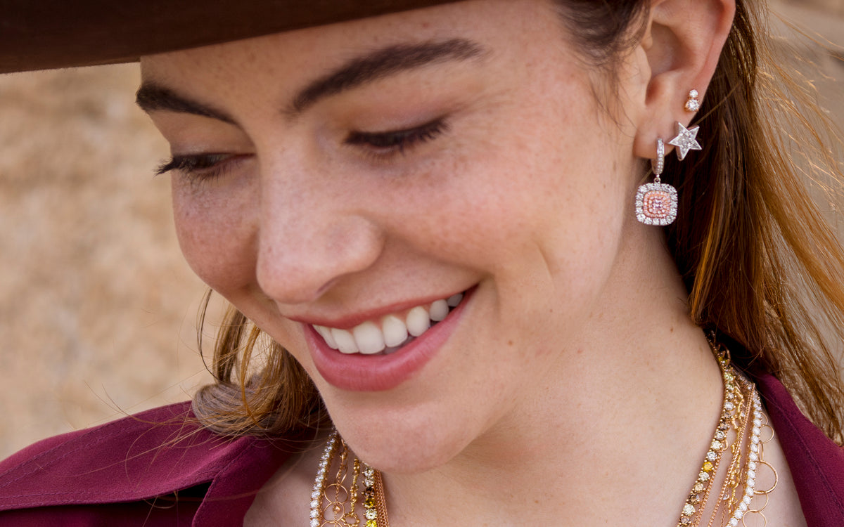 Bespoke pink diamond, white diamond earring stack lead off this rose gold, white gold lifestyle diamond jewelry + apparel ensemble; shop help at 323-404-2959