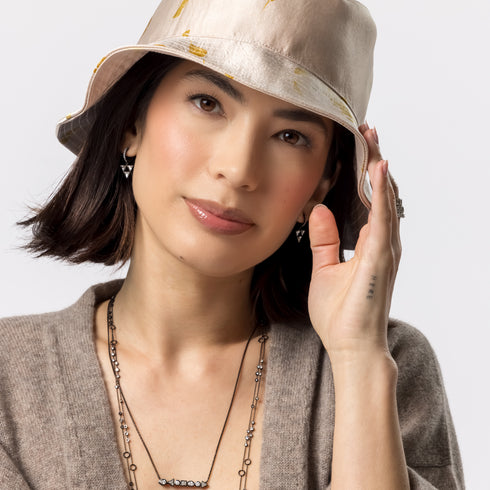 Dominique Cohen one of a kind bucket hats, from hand-dyed silk infused with pressed flowers <span class='visuallyhidden'>; 323-404-2959 for shop help.</span>