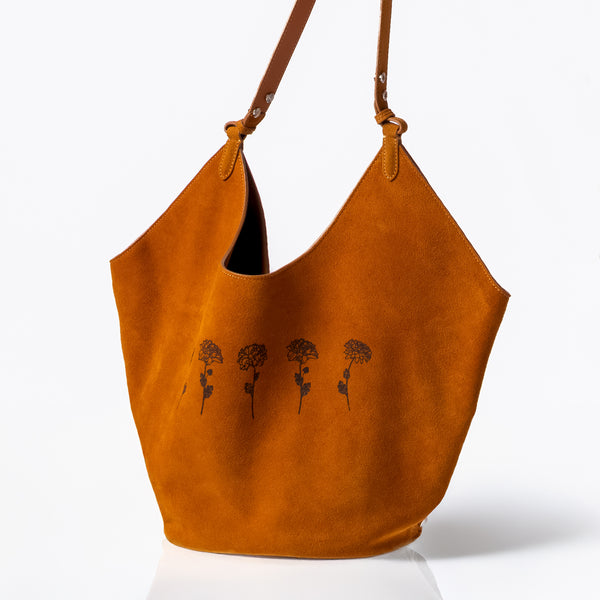 Dominique Cohen limited edition suede tote in camel with lotus flowers<span class='visuallyhidden'>; shopping help at 323-404-2959.</span>
