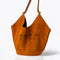 Dominique Cohen limited edition suede tote in camel with lotus flowers<span class='visuallyhidden'>; shopping help at 323-404-2959.</span>