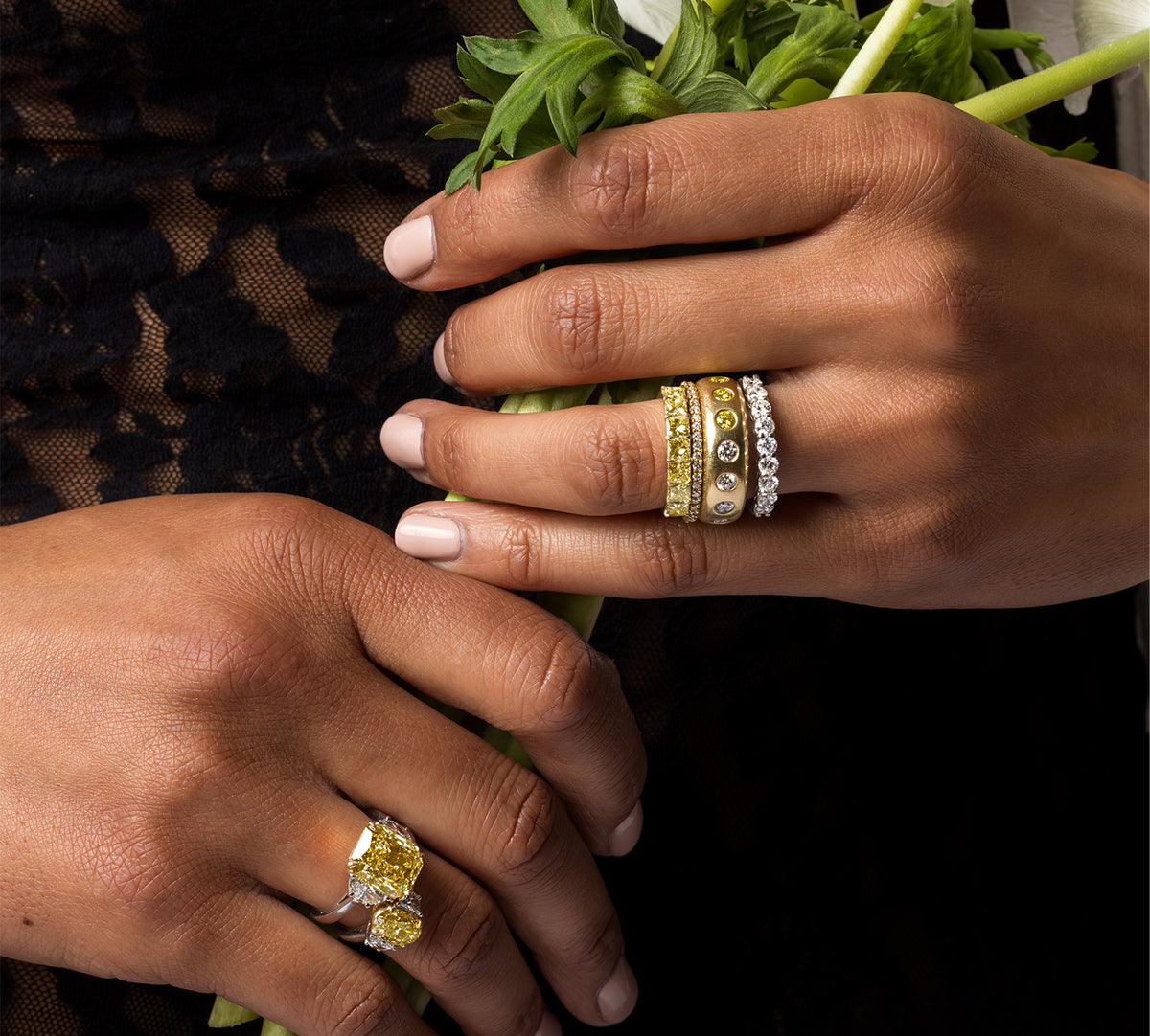 closeup of yellow diamond and white diamonds rings from shop the look > flash golden, shown on woman holding wildflowers; shop help at 760-978-9297.
