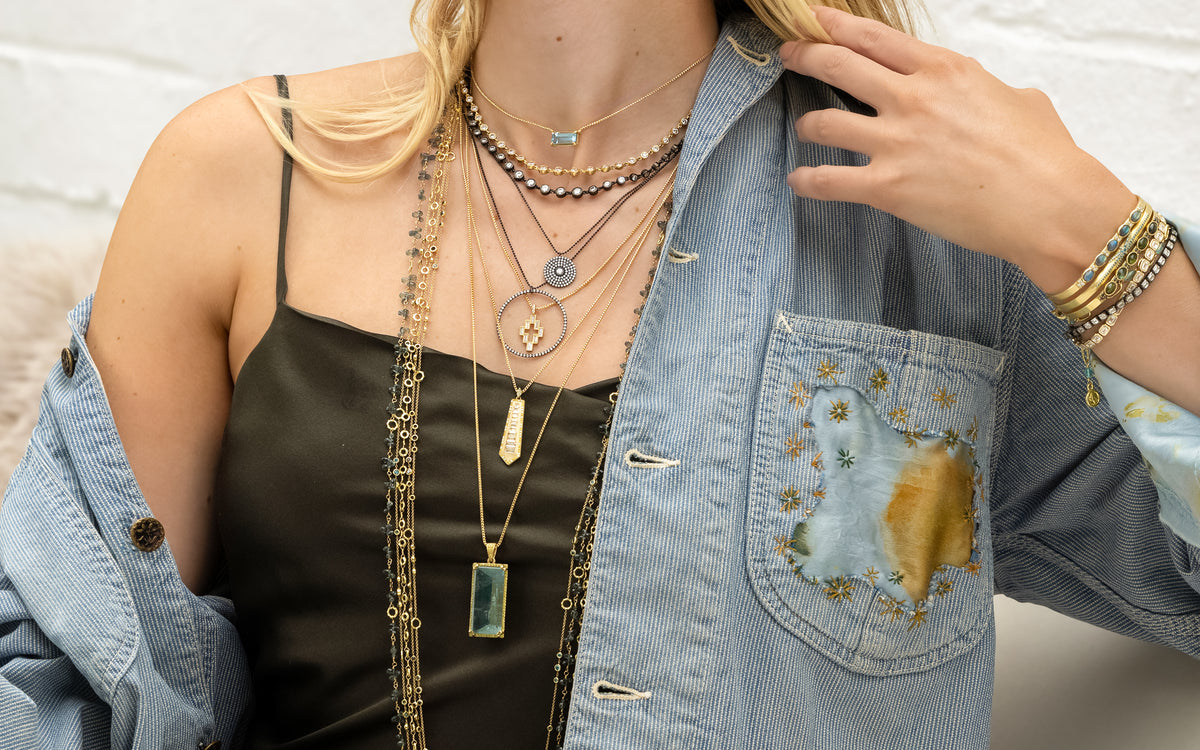 shop the look > peninsula, color-pop perfection in diamonds, yellow gold, aquamarine paired with denim and silk one of a kind apparel; shop help at 760-978-9297