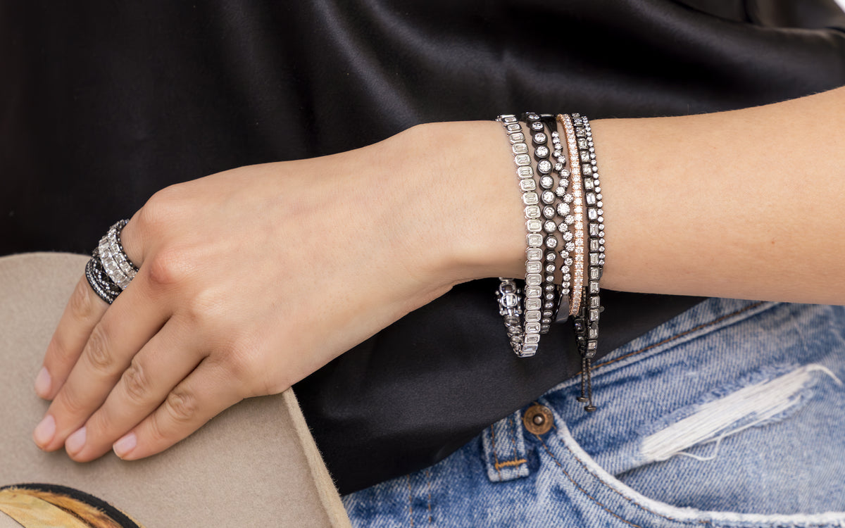 shop the look de-lovely, a laid back luxe lifestyle diamond jewelry and apparel collection in layers of black gold, rose gold, white gold design splendo, bracelet, rings closeup; shop help at 760-978-9297