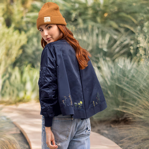 Dominique Cohen embroidered bomber jacket in wildflowers + navy<span class='visuallyhidden'>; shop help at 760-978-9297.</span>