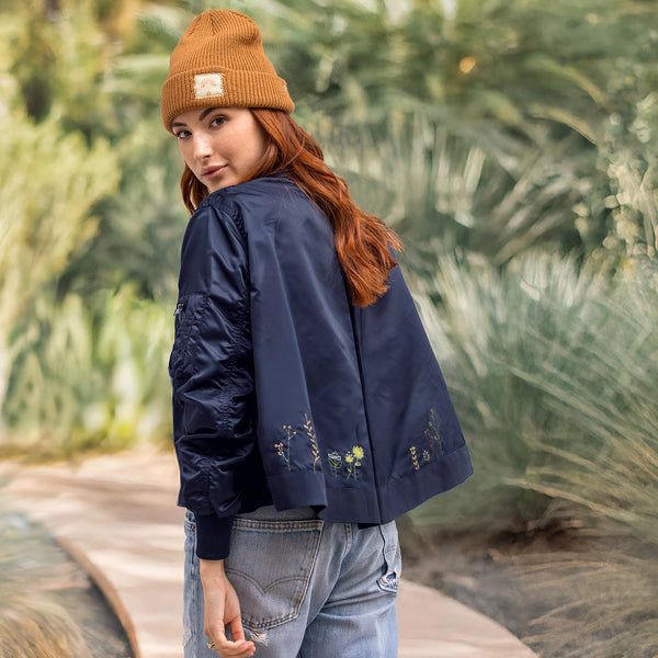 Dominique Cohen embroidered bomber jacket in wildflowers + navy<span class='visuallyhidden'>; shop help at 760-978-9297.</span>