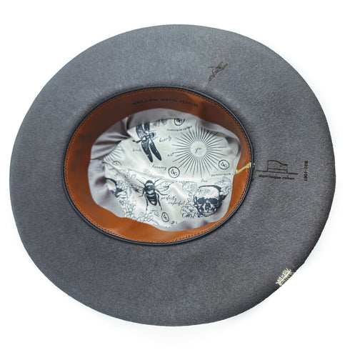 silk liners, leather sweatband (burned with mind over matter for daily inspo),<br>and a petite hummingbird add to the hat’s underside appeal <span class='visuallyhidden'>Call or text 323-404-2959 if you need shopping assistance.</span>