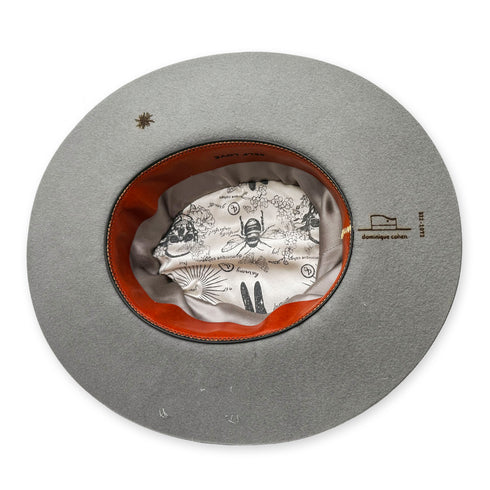 inside, a starburst burn motif compliments the<br>leather sweatband, and silk liners <span class='visuallyhidden'>Text, phone 323-404-2959 for shopping assistance.</span>