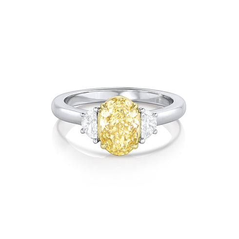 fancy light yellow oval diamond ring bookended in white diamonds;<br>yellow diamond set in yellow gold, rest of ring in platinum <span class='visuallyhidden'>Call or text 323-404-2959 if you need shopping assistance.</span>