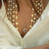 in morganite, close up<br>shop the look > not your mother’s pearls <span class='visuallyhidden'>Call, text 323-404-2959 for shopping help.</span>