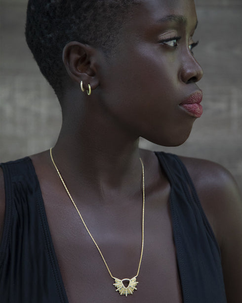 yellow gold sis dressed in white diamonds, and in yellow diamonds;<br>with our sunburst pendant necklace in blue sapphires and black diamonds <span class='visuallyhidden'>Call or text 323-404-2959 if you need shopping assistance.</span>